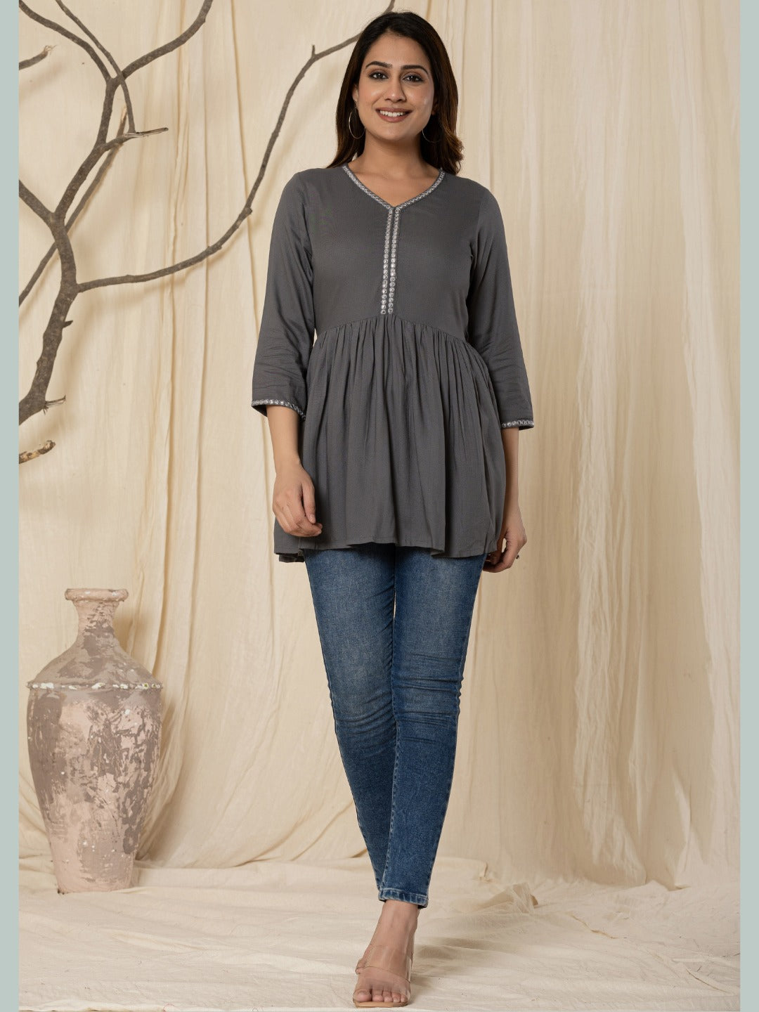Solid Embroidered Peplum Top -Grey